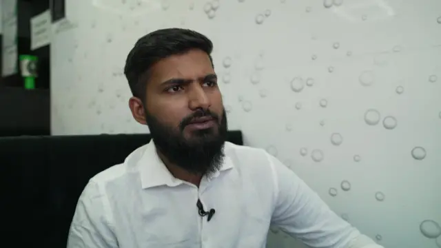 Sameer Rafik in a white shirt.