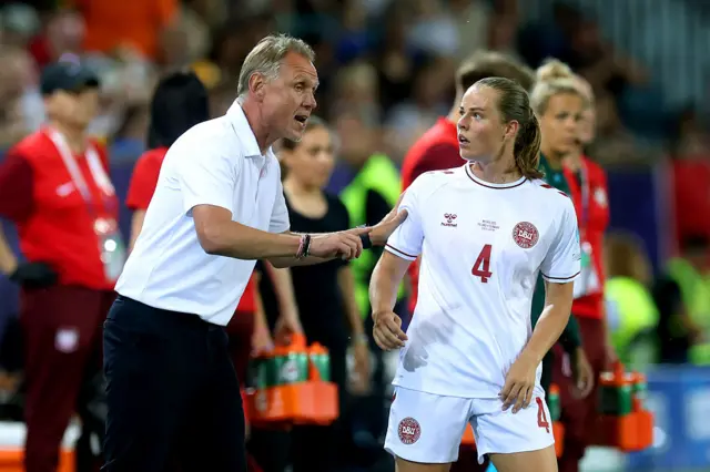 Andree Jeglertz, Head Coach of Denmark, gives instructions to Emma Faerge of Denmark during the UEFA Women's EURO 2025 Group C match between Poland and Denmark at Luzern Arena on July 12, 2025 in Lucerne, Switzerland.
