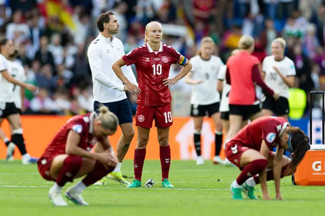 Denmark players react to their defeat to Germany
