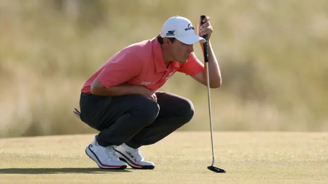 Matt Fitzpatrick lines up a putt