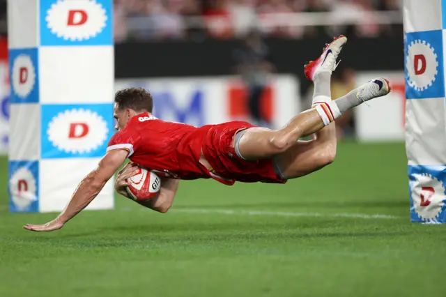 Wales' Kieran Hardy scores a try
