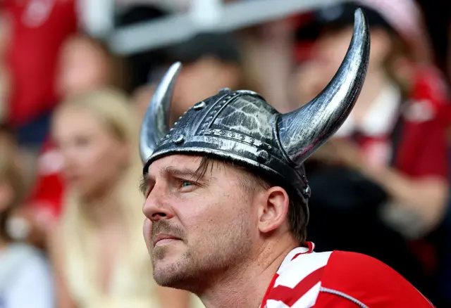 Denmark fans wears a viking horn helmet