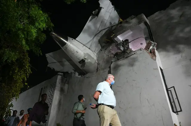 Rescue efforts at the site of the Air India flight crash on June 12, 2025 in Ahmedabad, India. 265 people died and many others were injured after the Air India 171 flight headed to London from Ahmedabad crashed moments after take-off. The plane crashed on a resident doctors' hostel in Ahmedabad, which suffered major damage in the accident