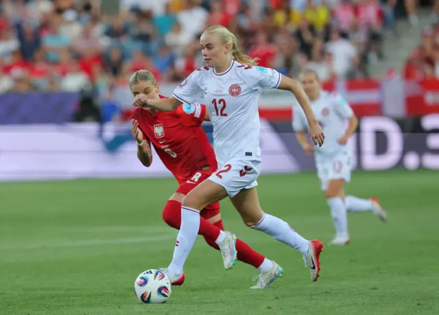 Poland's Ewelina Kamczyk in action with Denmark's Kathrine Moller Kuhl