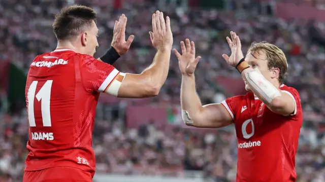 Josh Adams (left) celebrates with Blair Murray