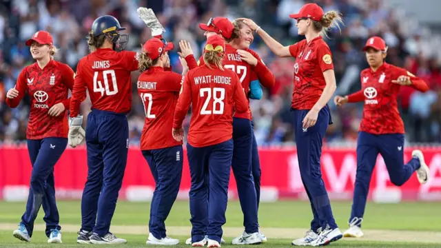 England celebrate taking the wicket