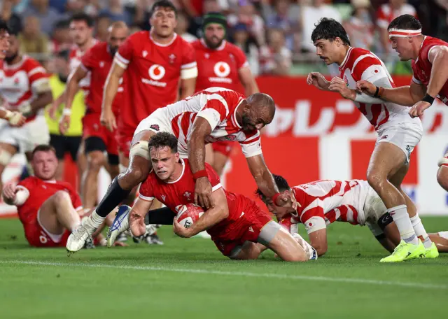 Wales' Kieran Hardy scores a try