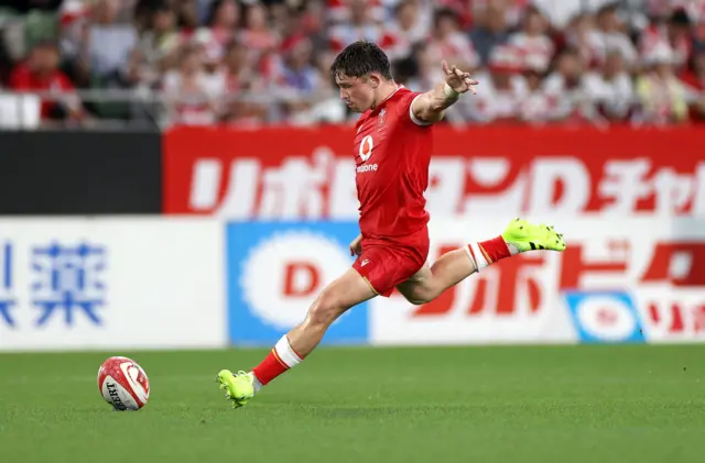 Wales' Dan Edwards kicks at goal