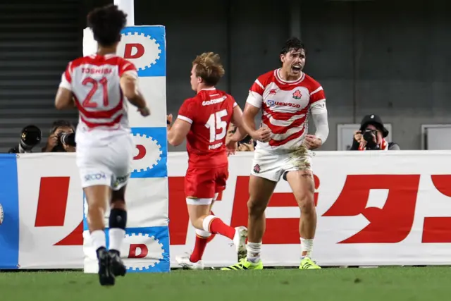 Japan's Dylan Riley celebrates