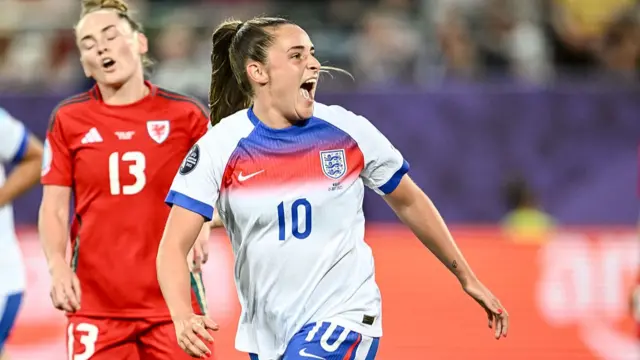 Toone of England celebrates after scoring her team's second goal