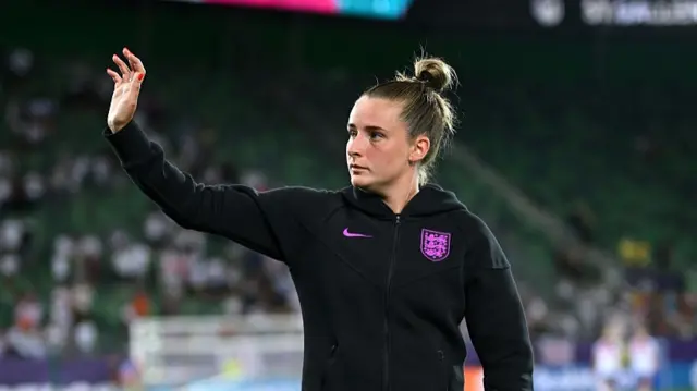 Ella Toone of England waves to the fans following victory
