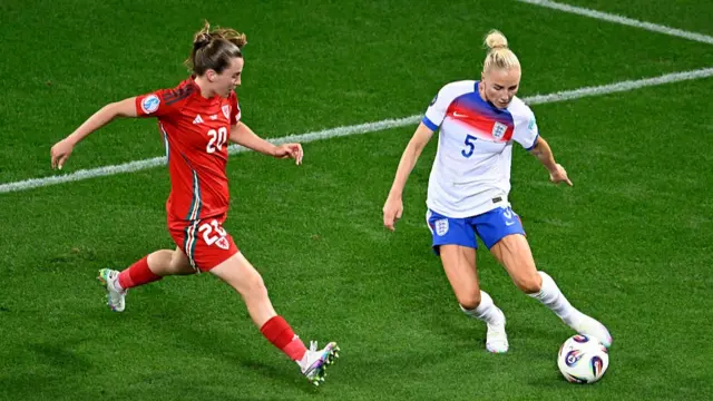 Alex Greenwood of England is put under pressure by Carrie Jones of Wales