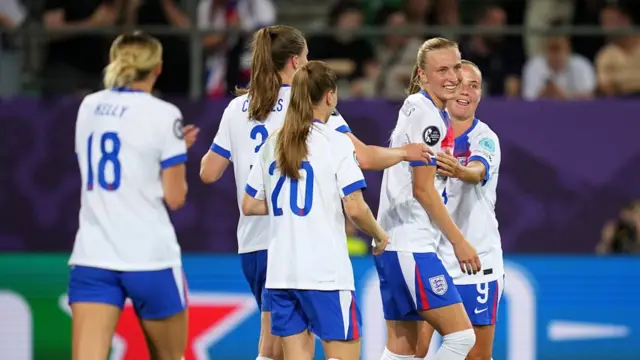 Aggie Beever-Jones of England celebrates with teammates after scoring her team's sixth goal