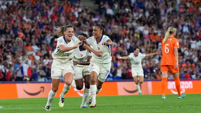 Sandie Toletti of France celebrates scoring her team's first goal