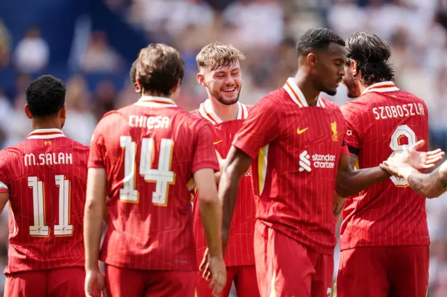 Liverpool's Conor Bradley (centre) celebrates scoring their side's first goal during the pre-season friendly match at Deepdale Stadium, Preston