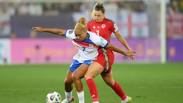 Lauren James of England is challenged by Gemma Evans