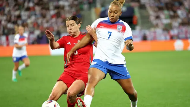 Angharad James-Turner of Wales and Lauren James of England compete for the ball