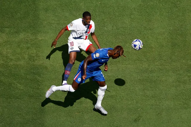 Trevoh Chalobah heads away from Ousmane Dembele