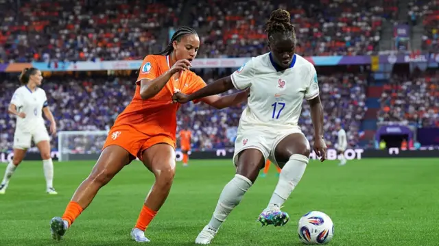 Sandy Baltimore of France battles for possession with Chasity Grant of the Netherlands