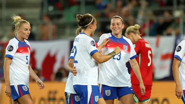 Alessia Russo of England celebrates with teammates after scoring her team's fourth goal