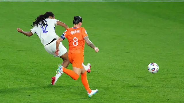Marie-Antoinette Katoto of France scores her team's second goal under pressure from Sherida Spitse of the Netherlands