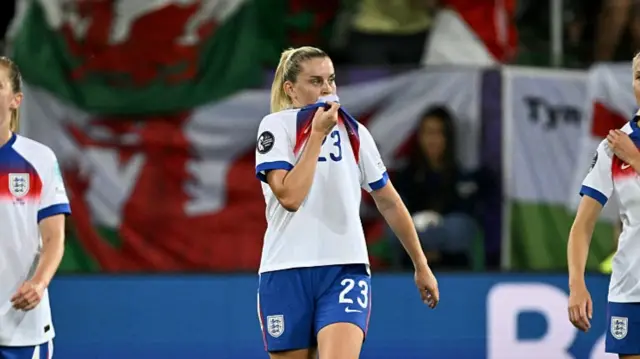 England's forward #23 Alessia Russo celebrates with teammates England's midfielder #04 Keira Walsh and England's defender #06 Leah Williamson after scoring the fourth goal