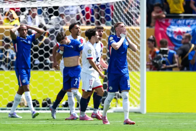 Cole Palmer reacts after missing the target