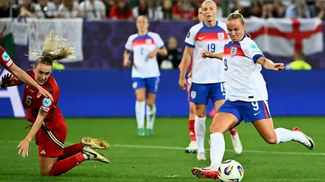 England's forward #09 Beth Mead shoots to score the fifth goal