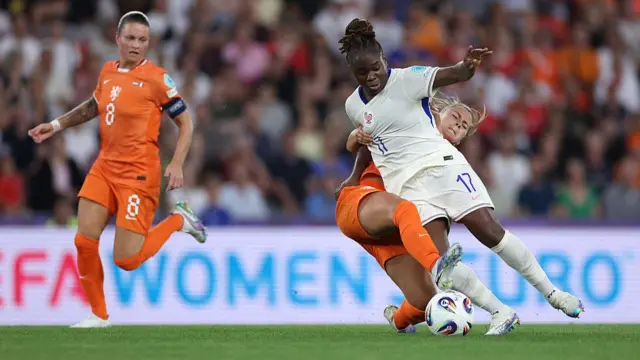 Sandy Baltimore of France is challenged by Victoria Pelova of the Netherlands