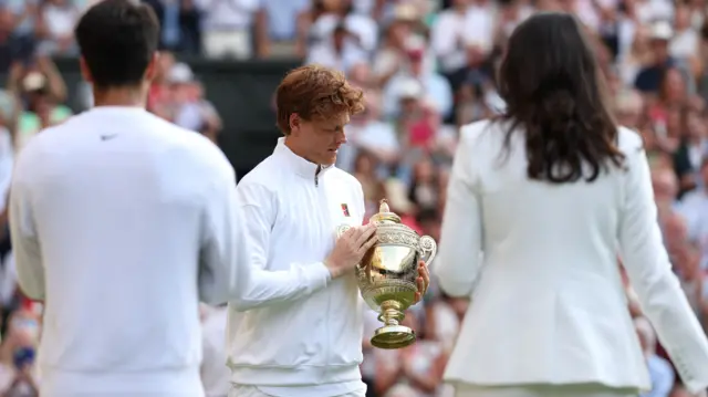 Jannik Sinner with the Wimbledon trophy