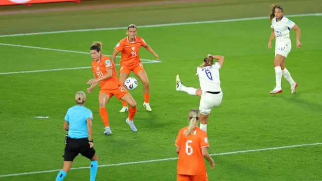 Sandie Toletti of France scores her team's first goal under pressure from Dominique Janssen and Kerstin Casparij of the Netherlands