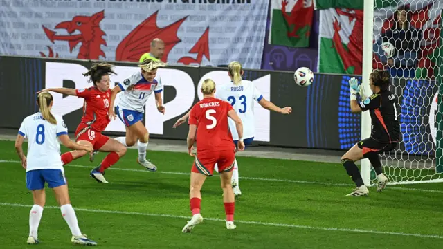 Lauren Hemp of England scores her team's third goal