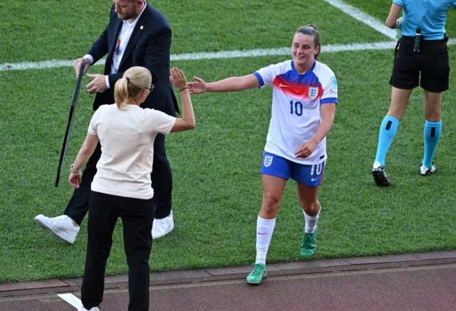England's Ella Toone with manager Sarina Wiegman after being substituted