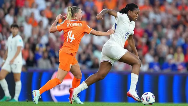 Antoinette Katoto of France is challenged by Jackie Groenen of the Netherlands