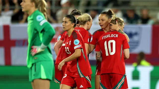 Hannah Cain of Wales celebrates with teammate Jess Fishlock after scoring her team's first goal
