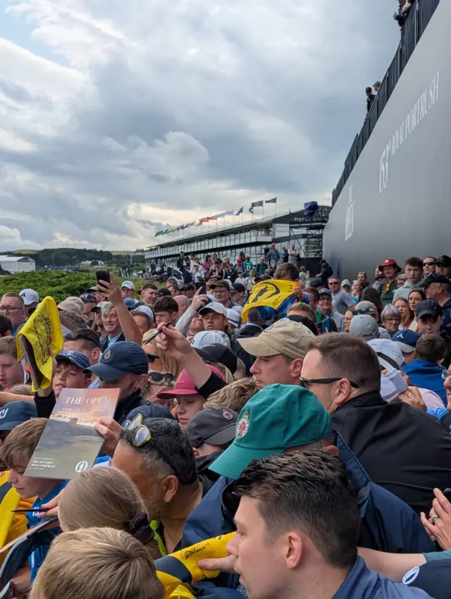Fans gather to get Rory McIlroy's autograph