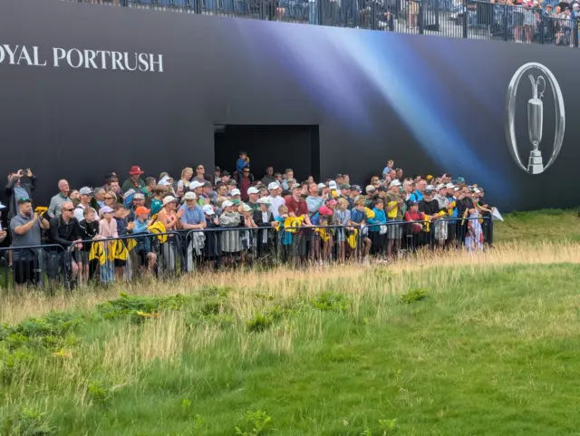 Fans wait for Rory McIlroy's signature