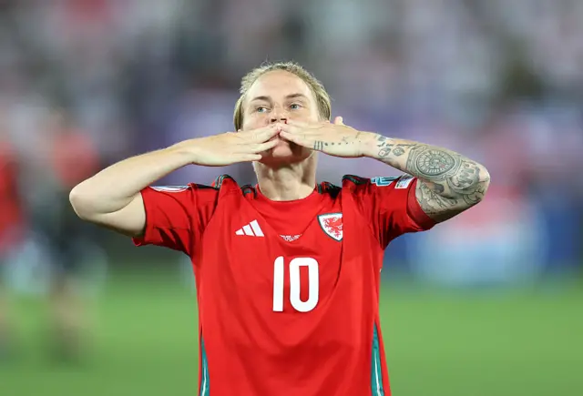Jess Fishlock of Wales shows her appreciation to the fans
