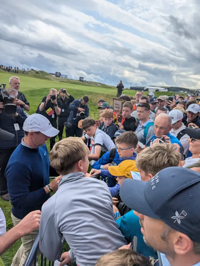 Rory McIlroy signs autographs for fans