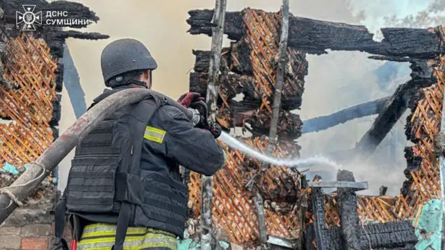 A firefighter with a hose