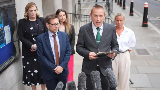 Lewis Basford speaking to the media outside the Old Bailey