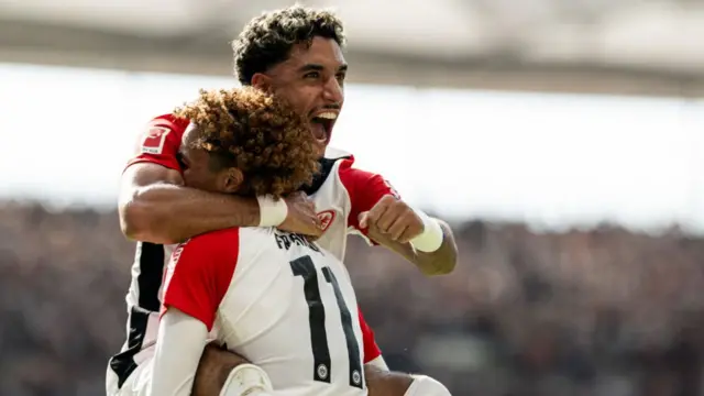 Hugo Ekitike of Eintracht Frankfurt celebrates with team mate Omar Marmoush
