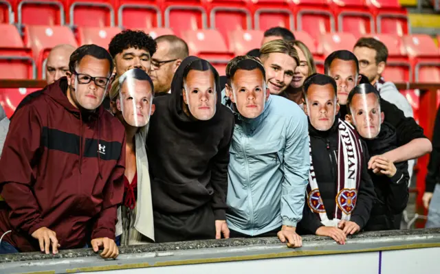 Hearts fans with Lawrence Shankland masks on