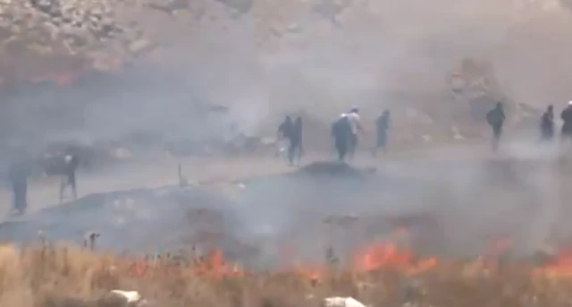 Still image from social media footage of individuals entering Syria from Israel.