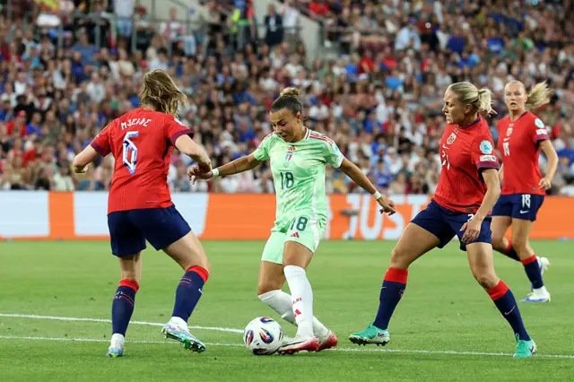 Norway's Tuva Hansen in action with Italy's Arianna Caruso