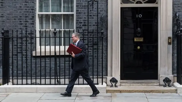 Keir Starmer leaves Downing Street carrying red folder