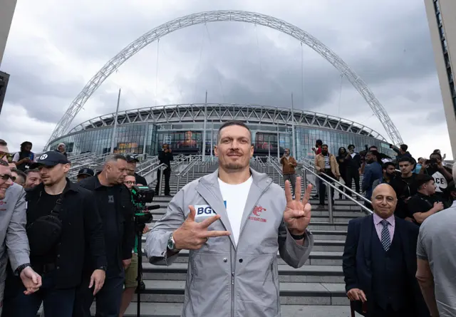 Oleksandr Usyk posing outside Wembley Stadium