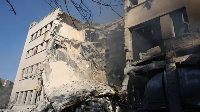 Syrian defence ministry with huge hole in wall and collapsed floors