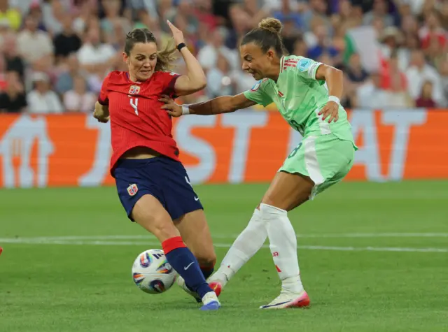 Norway's Tuva Hansen in action with Italy's Arianna Caruso