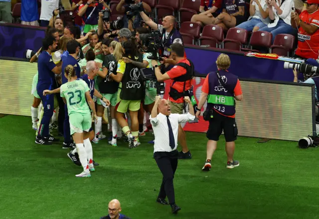 Italy's Cristiana Girelli celebrates scoring their second goal with teammates as coach Andrea Soncin react